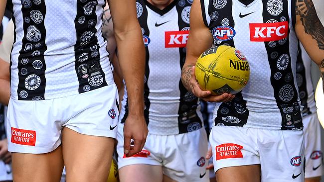 MELBOURNE, AUSTRALIA - MAY 21: The Magpies walk out onto the field during the round 10 AFL match between Carlton Blues and Collingwood Magpies at Melbourne Cricket Ground, on May 21, 2023, in Melbourne, Australia. (Photo by Quinn Rooney/Getty Images)