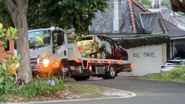 A burnt-out car on a tow truck after the incident in December. Picture: NewsWire