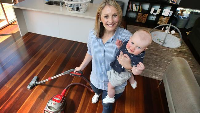 Brooke Ryan does a lot of unpaid housework while caring for baby Oliver. Picture: David Caird