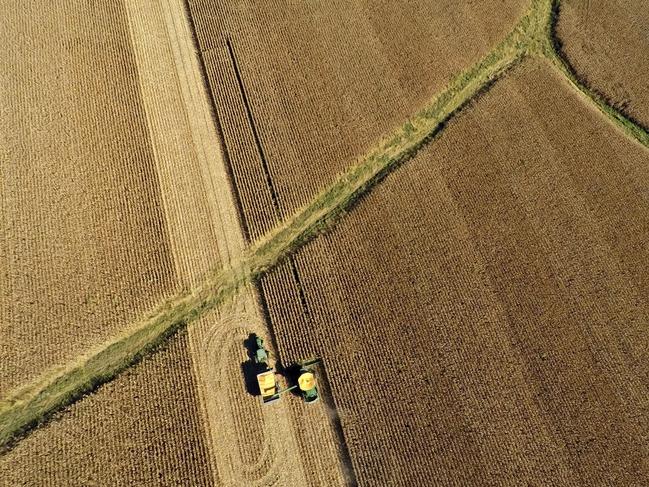 Non-GMO corn is harvested with a John Deere & Co. 9670 STS combine harvester in this aerial photograph taken above Malden, Illinois, U.S., on Wednesday, Sept. 30, 2015. Corn exports by the U.S., the biggest producer, are running 28 percent behind last year's pace as a stronger dollar entices buyers to go elsewhere for cheaper supply. Photographer: Daniel Acker/Bloomberg