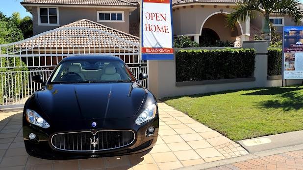 Real estate agents Maserati swiped during home open at luxury estate.