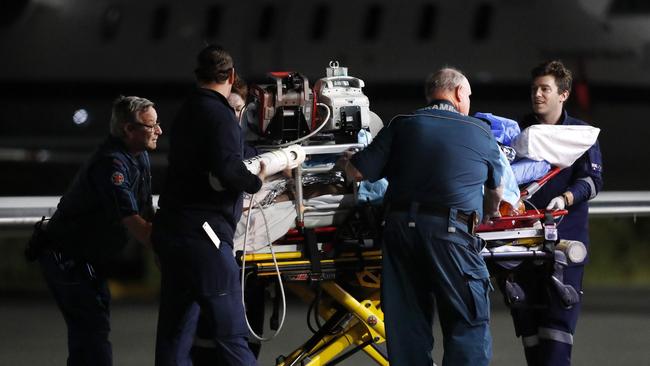 Injured workers from an explosion at Grosvenor coal mine at Moranbah arriving in Brisbane last night. Picture: Josh Woning