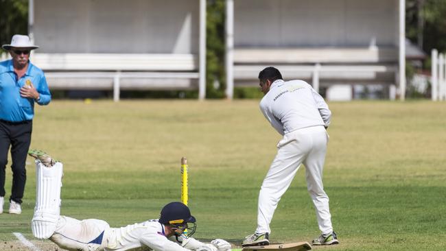 Brandon Walker slides in safe for Diggers. Picture: Kevin Farmer