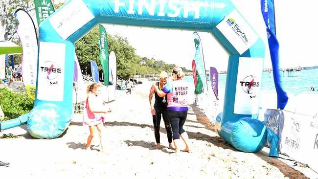 Rebekah Weller first out of the water in the 10km Enzos open swim classic. Picture: Brendan Bowers