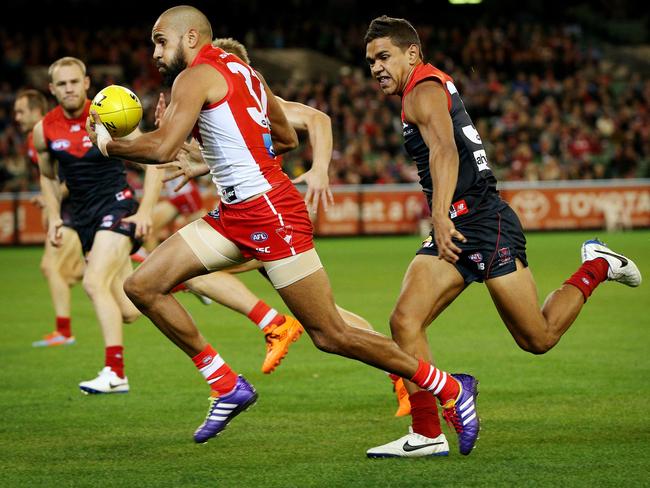 Neville Jetta is pursuit of cousin Lewis Jetta in Round 6. Picture: Colleen Petch.