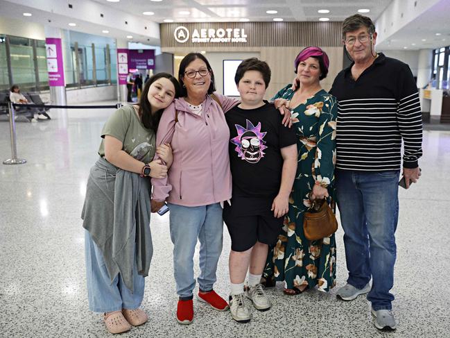 Mya Nussbaum, 10, Dina Thaler, Adam Nussbaum, 13, Ayelet Nussbaum and Shai Thaler wait for their family members to arrive from Israel at Sydney International Airport. Picture: Adam Yip