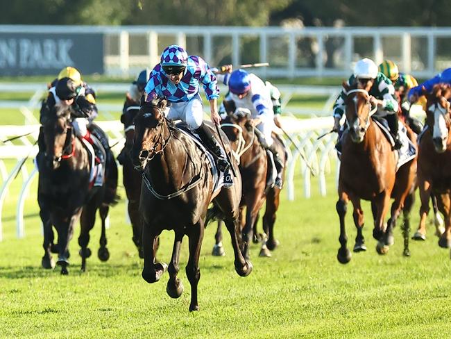 SYDNEY, AUSTRALIA - APRIL 13: Declan Bates riding Pride of Jenni wins Race 8 Queen Elizabeth Stakes during Sydney Racing: The Championships at Royal Randwick Racecourse on April 13, 2024 in Sydney, Australia. (Photo by Jeremy Ng/Getty Images)