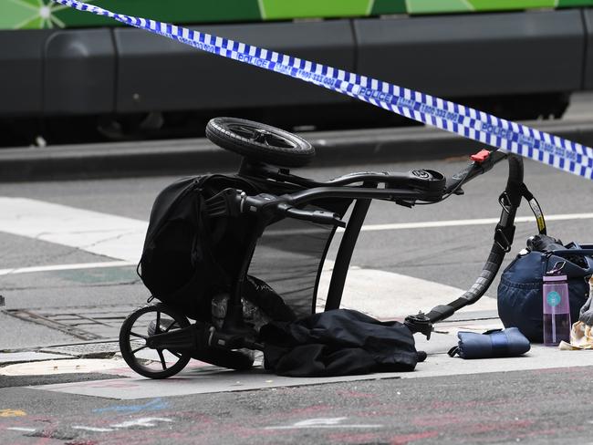 A pram is seen on the corner of Bourke and William Street at the scene where man has gone on a rampage in a car through busy Bourke St mall, Melbourne, Friday, Jan. 20, 2017. Three people are dead after a man deliberately drove into a crowd in Melbourne's Bourke St mall. (AAP Image/Julian Smith) NO ARCHIVING
