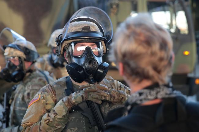 A protester confronts a National Guardsmen in Minneapolis. Picture: AFP