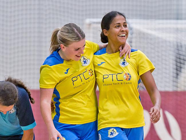 Crusaders women's players celebrate a goal.