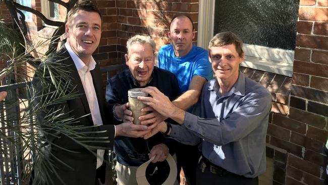 Michael Regan with Ross, Richard and Mark Sterland and the time capsule