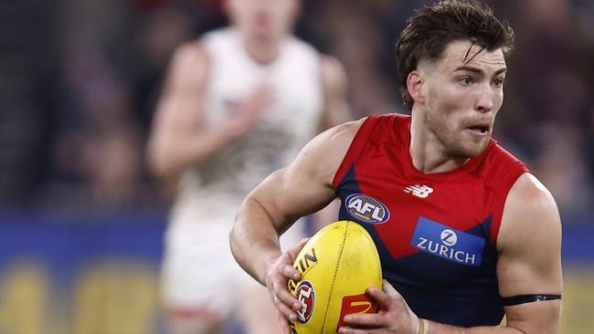 MELBOURNE, AUSTRALIA - AUGUST 13: Jack Viney of the Demons runs with the ball during the round 22 AFL match between the Melbourne Demons and the Carlton Blues at Melbourne Cricket Ground on August 13, 2022 in Melbourne, Australia. (Photo by Darrian Traynor/Getty Images)