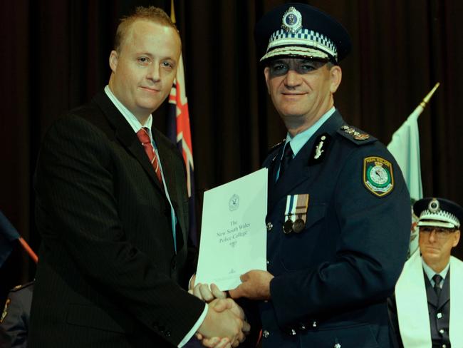 Ryan Jeffcoat with Commissioner Andrew Scipione in June 2009 being presented with his designation as a Detective.