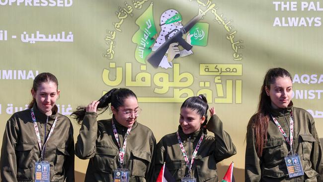 Naama Levy, Liri Albag, Daniella Gilboa and Karina Ariev on a stage before Hamas fighters hand them over to a team from the Red Cross in Gaza City. Picture: Omar Al-Qattaa/AFP