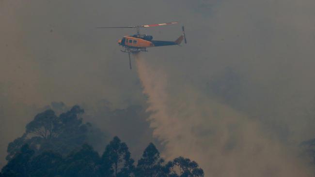 A waterbombing helicopter seen from Rileys Creek Rd, Geeveston. Picture: NIKKI DAVIS-JONES