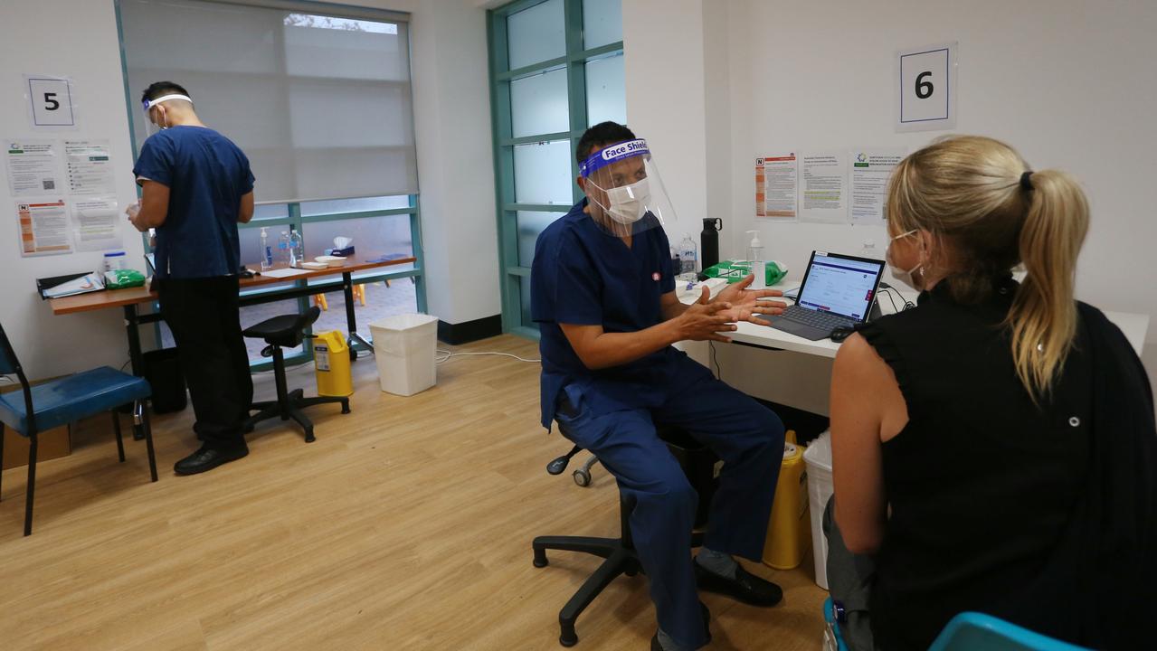 A client about to receive the Pfizer vaccine at St Vincent’s. Picture: Lisa Maree Williams/Getty Images