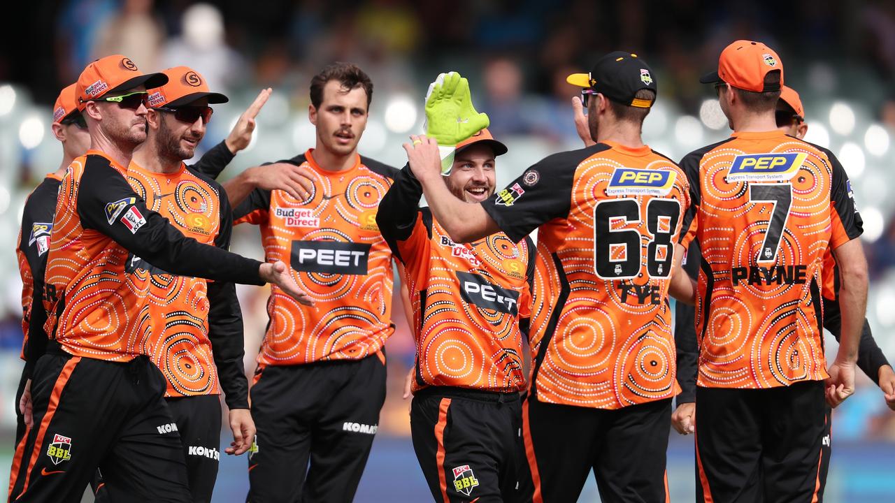 Perth Scorchers players celebrate a wicket for Lance Morris.