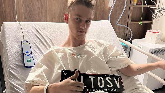 Cooper Wilson in hospital with his number plates.