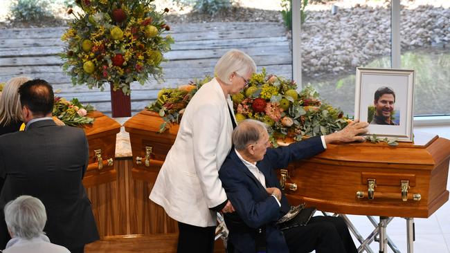 Friends of the family are seen at the funeral of Dick and Clayton Lang at Drumminor Gardens Cemetery. Picture: AAP Image/David Mariuz