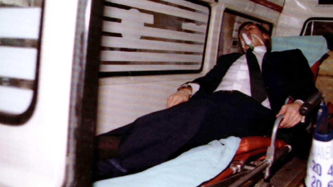 Skase leaving court by ambulance in 1994.