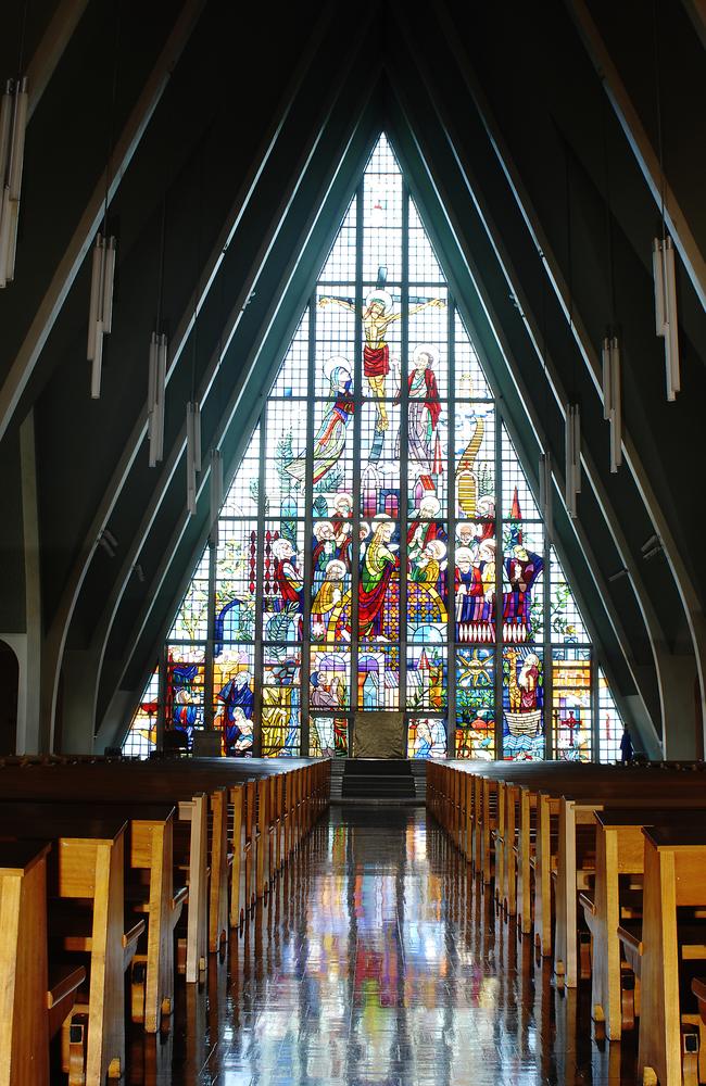 The dramatic roof and stained glass window inside the new chapel.