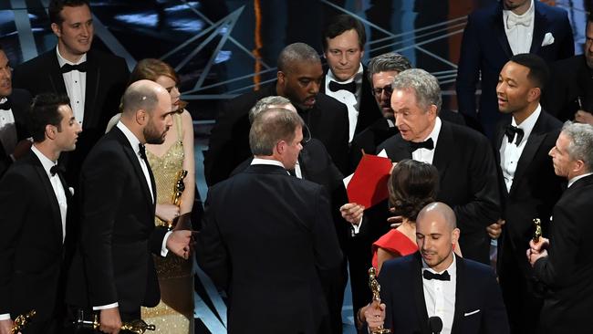 HOLLYWOOD, CA - FEBRUARY 26:  'La La Land' producer Jordan Horowitz (C) speaks while holding an oscar and the winner card before reading the actual Best Picture winner 'Moonlight' onstage during the 89th Annual Academy Awards at Hollywood & Highland Center on February 26, 2017 in Hollywood, California.  (Photo by Kevin Winter/Getty Images)