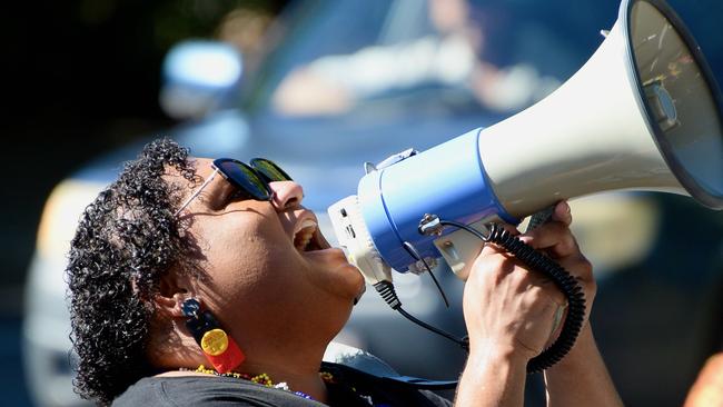 Stacee Ketchell on the megaphone at Cairns NAIDOC march 2022. Photo: Isaac McCarthy.