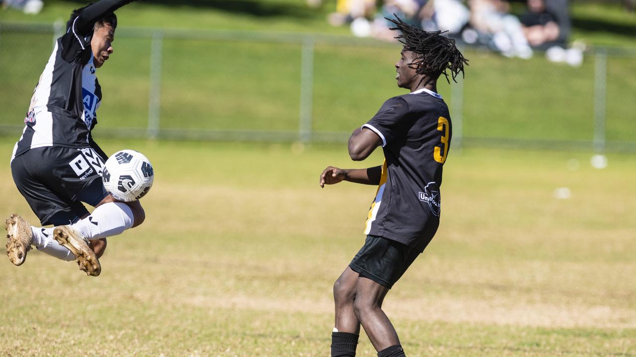 Umesh Rai (left) of Willowburn against Peter Jeapson of West Wanderers in U23 men FQ Darling Downs Presidents Cup football at West Wanderers, Sunday, July 24, 2022. Picture: Kevin Farmer