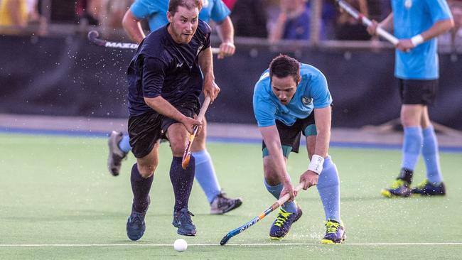 TITLES IN TOWN: Stafford Strikers’ Micah Mathewson (left) battles for the ball during the Club Glenvale Challenge. Toowoomba is set to host the Queensland titles in May.