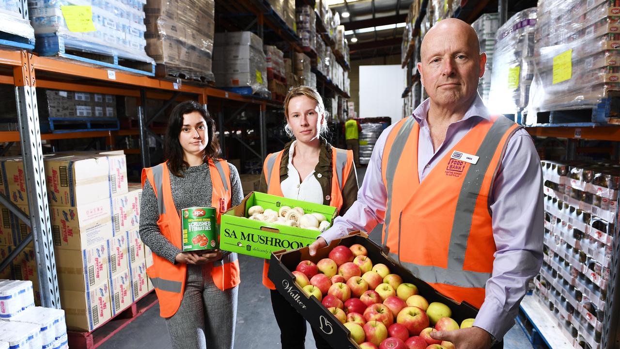 Foodbank staff Zoe Stangoulis, Tara Ellis and chief executive Greg Pattinson at the Edwardstown warehouse. Picture Mark Brake