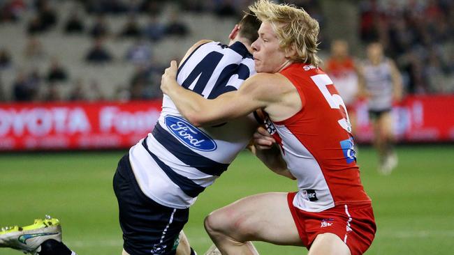 Isaac Heeney with one of his trademark tackles. Picture: Colleen Petch.
