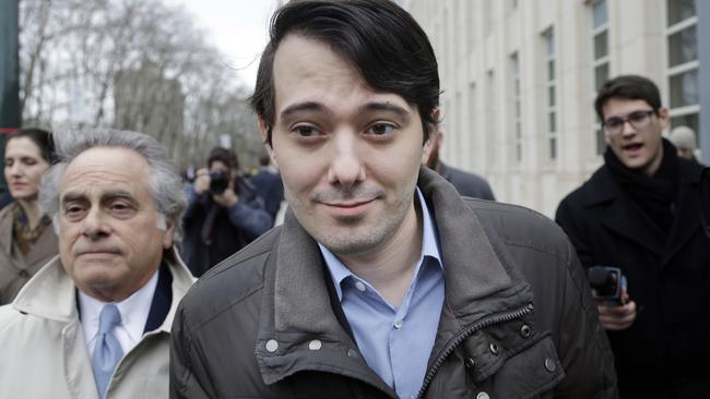 Former Turing Pharmaceuticals CEO Martin Shkreli, center, leaves court with his lawyer Benjamin Brafman, left, Wednesday, Feb. 3, 2016, in New York. Shkreli, who has become the poster child of pharmaceutical-industry greed after hiking the price of an anti-infection drug by more than 5,000 percent, is scheduled to appear at a congressional hearing on Thursday. (AP Photo/Seth Wenig)