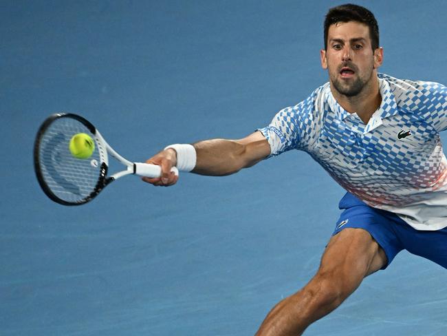 MELBOURNE, AUSTRALIA - JANUARY 29: Novak Djokovic of Serbia plays a forehand in the MenÃ¢â¬â¢s Singles Final against Stefanos Tsitsipas of Greece during day 14 of the 2023 Australian Open at Melbourne Park on January 29, 2023 in Melbourne, Australia. (Photo by Quinn Rooney/Getty Images)