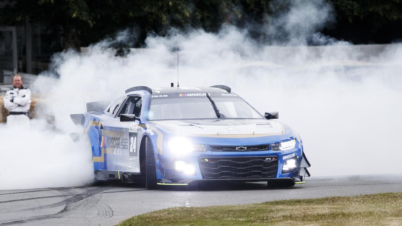 Jenson Button driving a NASCAR racer at the Goodwood Festival of Speed. (Photo by John Phillips/Getty Images)