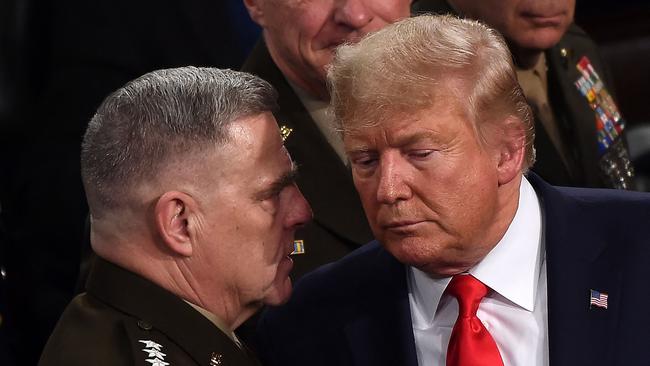 Mark Milley and Donald Trump confer after the then president’s last State of the Union address in February 2020. Picture: AFP