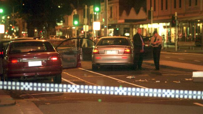 Police at the scene on Bay Street, Port Melbourne, where Victor Peirce was found dead.