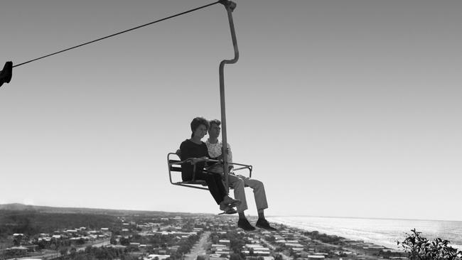 Sandra Hooey, of Moorooka and Bill Bacs of Cooper's Plains riding the chairlift in July 1962