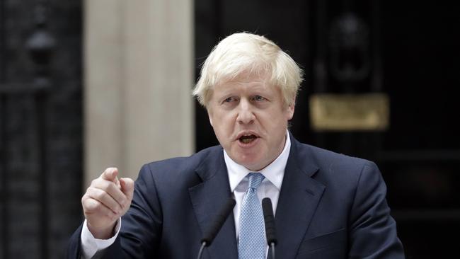 Britain's Prime Minister Boris Johnson speaks to the media outside 10 Downing Street in London, Monday, Sept. 2, 2019. Johnson says he doesn't want an election amid Brexit crisis and issued a rallying cry to lawmakers to back him in securing Brexit deal. (AP Photo/Matt Dunham)