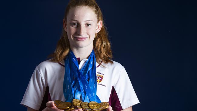 St Peters Lutheran College student Mollie O'Callaghan with a swag of medals last year. (AAP Image/Renae Droop)