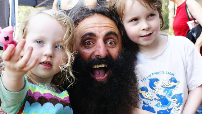 Gone wild ... Costa Georgiadis, host of ABC’s Gardening Australia, entertains young fans at the launch of the Rose Bay Community Garden, Sydney. Picture: Supplied