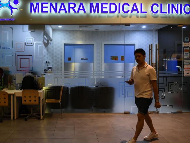 A pedestrian walks in front of a clinic where Kim Jong-nam was taken after falling ill at Kuala Lumpur airport. Picture: Mohd Rasfan