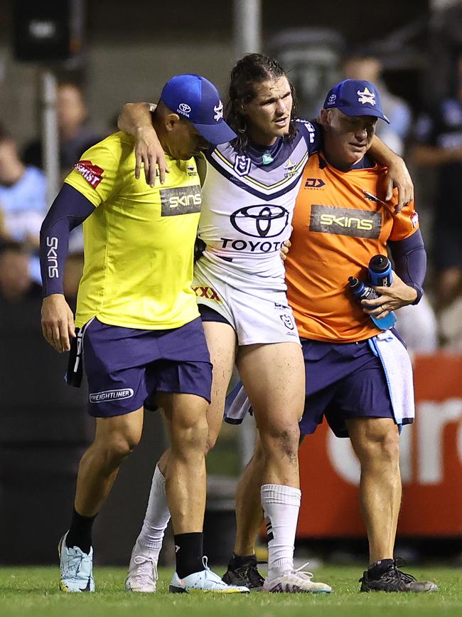 SYDNEY, AUSTRALIA - APRIL 27: Tom Chester of the Cowboys is assisted off the field by trainers after an injury during the round nine NRL match between Cronulla Sharks and North Queensland Cowboys at PointsBet Stadium on April 27, 2023 in Sydney, Australia. (Photo by Cameron Spencer/Getty Images)