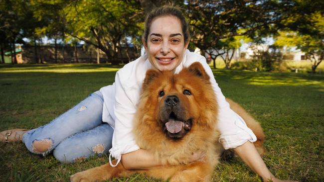 Teddy home with his owner, Melissa Feijoo, on Friday after escaping a Brisbane vet and being found by good Samaritans. Picture: Glenn Hunt