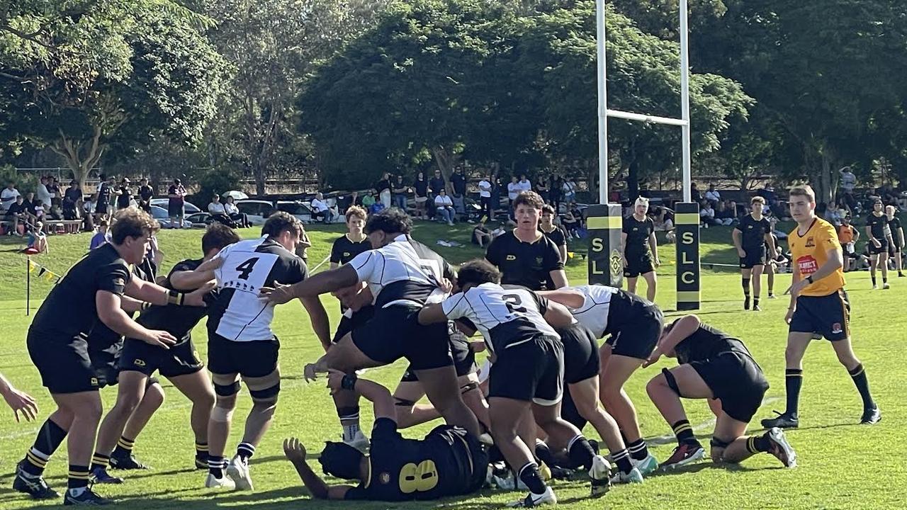 Lehopo Leota, No.4, goes over the top as Iona raid St Laurence’s line.