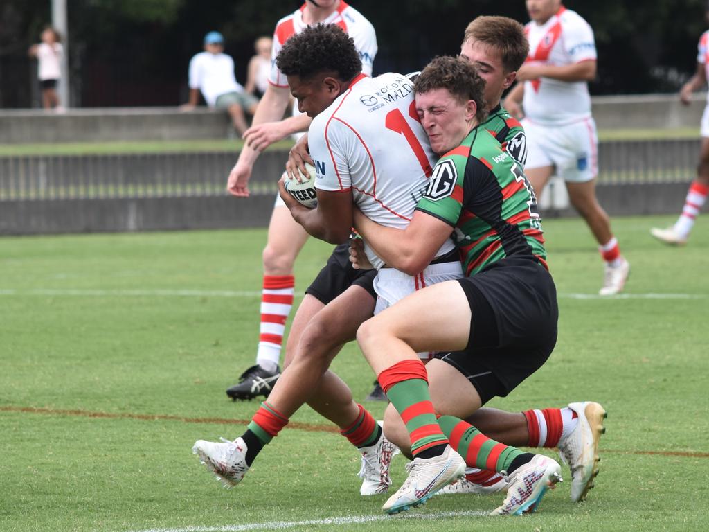 Cyrus Stanley-Traill is tackled by Harrison Rooke. Picture: Sean Teuma