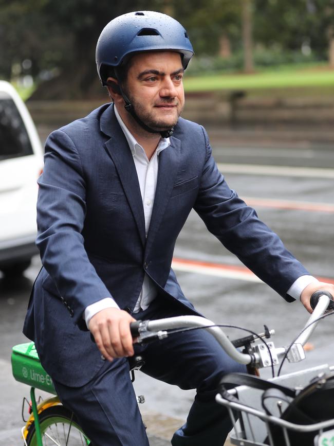 Sam Dastyari arrives at the ICAC hearing in Sydney on a hired pushbike. Picture: John Grainger.