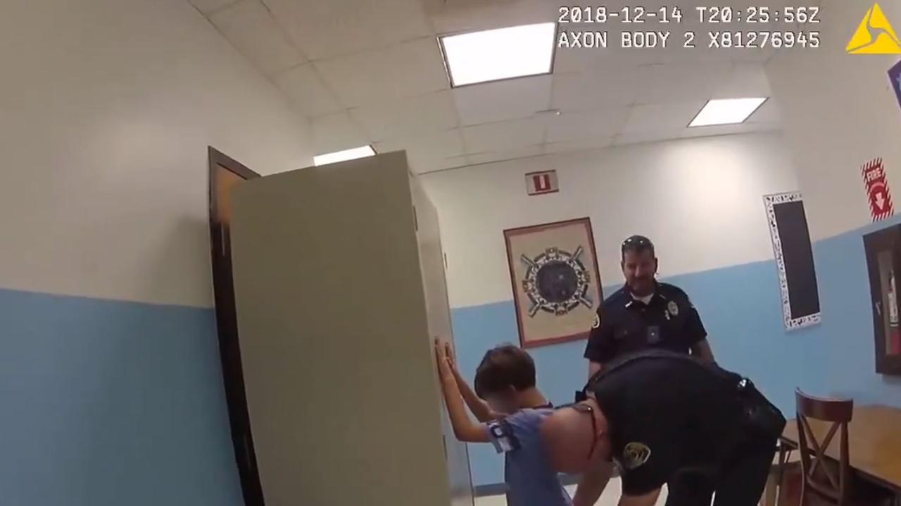 Footage shows the US police officers arresting the crying 8-year-old. Picture: KWPD