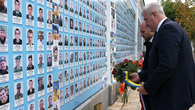 French Minister for Europe and Foreign Affairs Jean-Noel Barrot and Ukrainian Foreign Minister Andrii Sybiha lay flowers at the Memory Wall of Fallen Defenders of Ukraine outside Saint Michael's Cathedral, in Kyiv. Picture: AFP