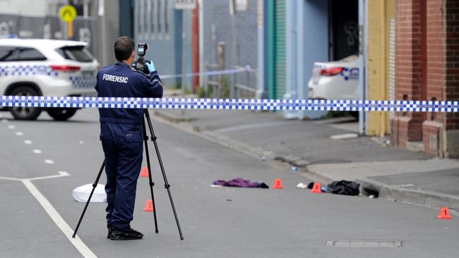 Police at the scene the morning after the fatal shooting. Picture: Andrew Henshaw