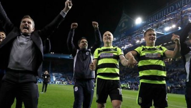 Aaron Mooy celebrates the penalty shootout win over Sheffield Wednesday.